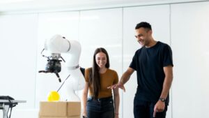 Two engineers collaborating on testing a futuristic robotic prototype in a modern indoor lab., tags: ios - pexel