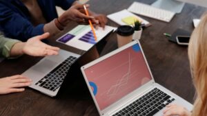 Group of professionals discussing data analytics in a modern office setting., tags: paid ads agency - pexel